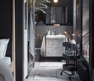 A grey bathroom idea by IKEA with marble effect flooring, white vanity