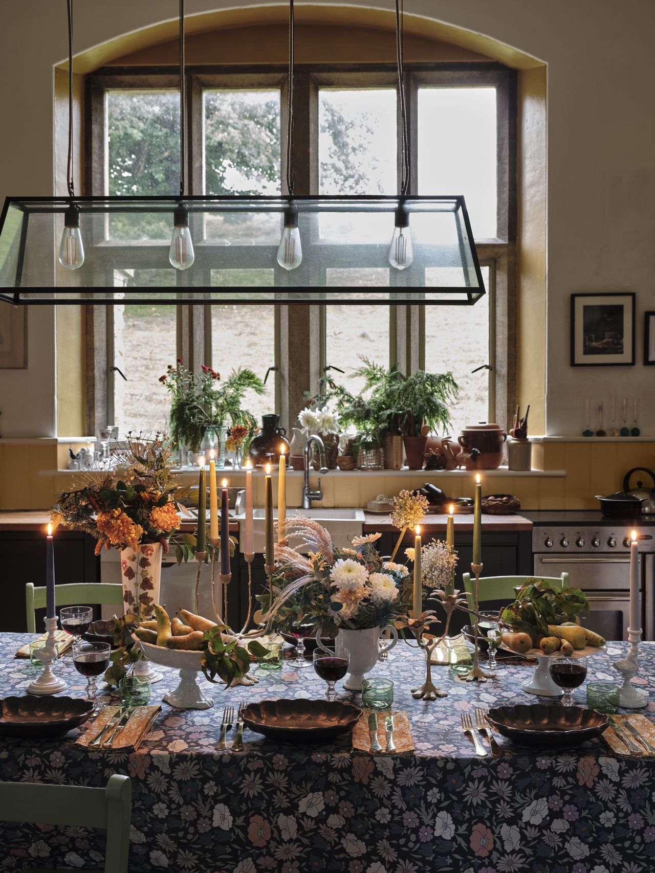 A kitchen with a full fall decor-inspired centrepiece