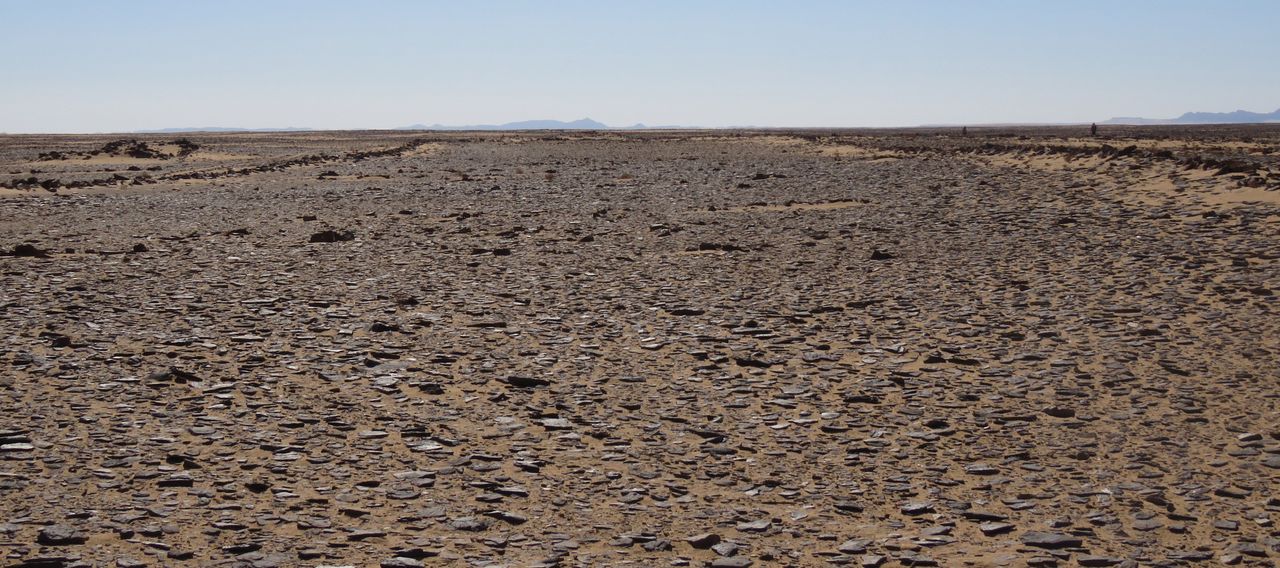 The largest mustatil discovered so far is 2,021 feet (616 meters) in length and covers an area of more than 236,000 square feet (22,000 square m). Research team members can be seen on the right for scale.