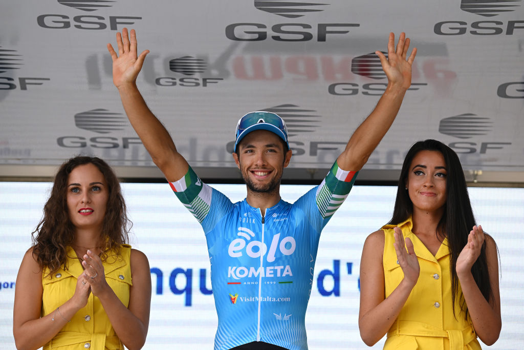 LIMOGES FRANCE AUGUST 19 Vincenzo Albanese of Italy and EoloKometa Cycling Team celebrates winning the stage on the podium ceremony after the 55th Tour du Limousin Nouvelle Aquitaine 2022 Stage 4 a 1748km stage from Saint Laurent sur Gorre to Limoges 289m TDL2022 on August 19 2022 in Limoges France Photo by Dario BelingheriGetty Images