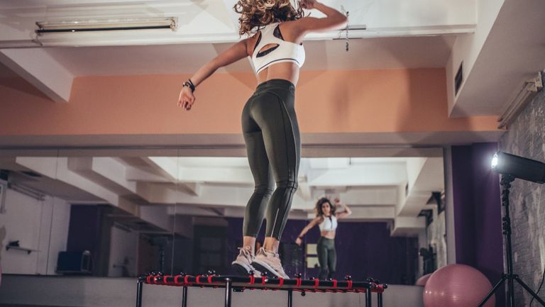 Woman working out on a trampoline