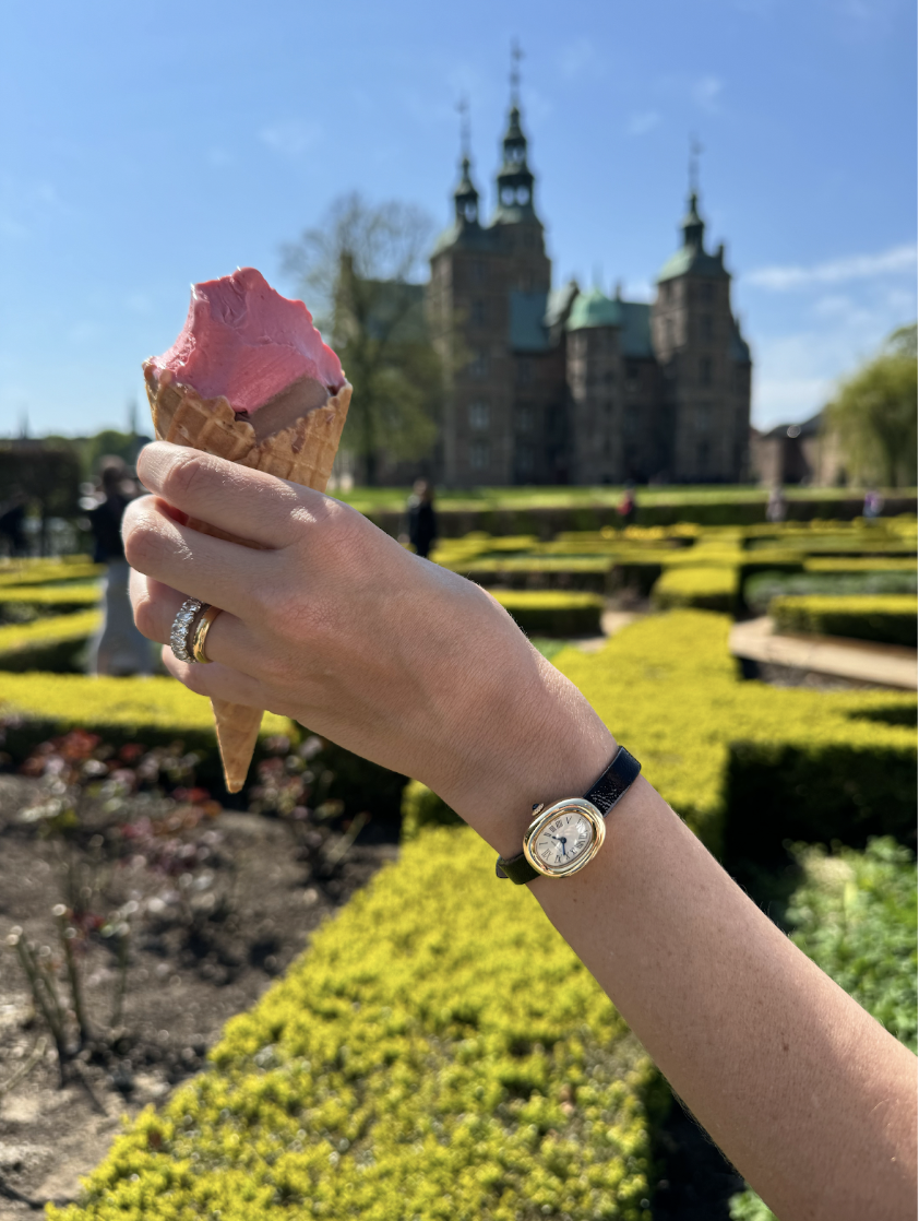 hand holding ice cream cone with cartier watch