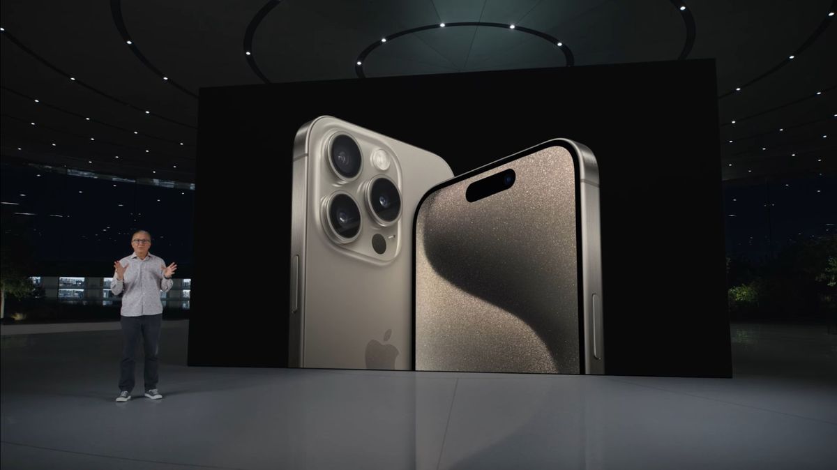 The iPhone 15 Pro and iPhone 15 Pro Max at Apple&#039;s September 2023 event, showing the front and back of the devices.