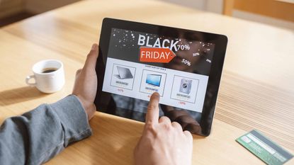 Photo of shopper using iPad for Black Friday sales