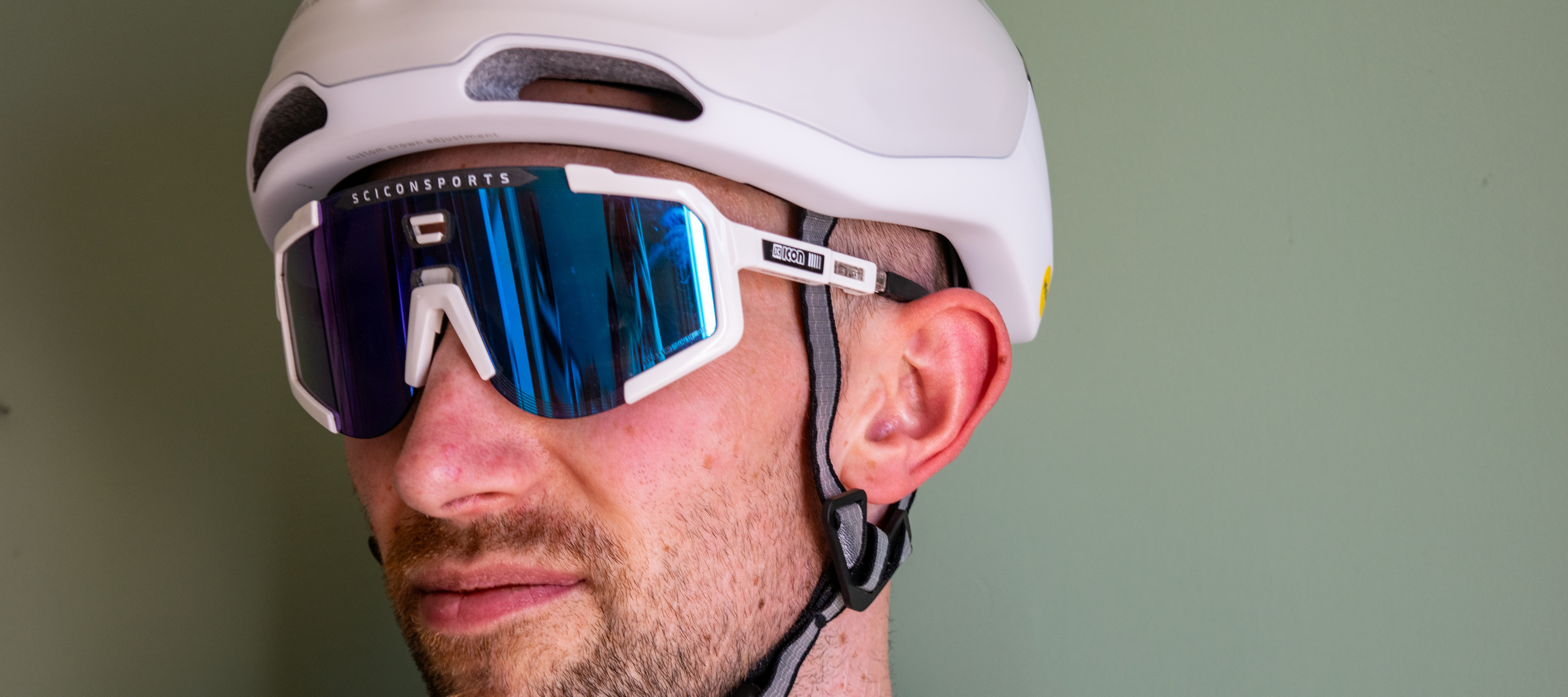 A man wearing a paor of scicon aeroscope sunglasses