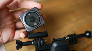 The DJI Action 2 action camera on a table
