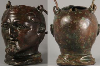 The back of the balsamarium has a brownish green patina. The jar can hold about 670 ml of liquid.