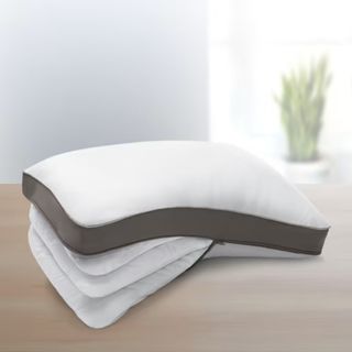 PlushComfort Ultimate Curved Pillow on a counter.