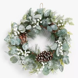 Snowy fir wreath with pinecones