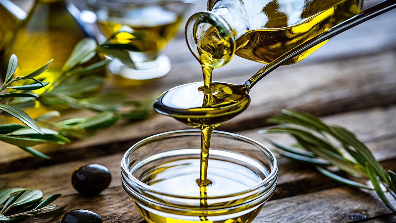 Olive oil pouring out a jar