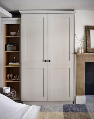 custom built wardrobe closet in small bedroom, open shelving on one side