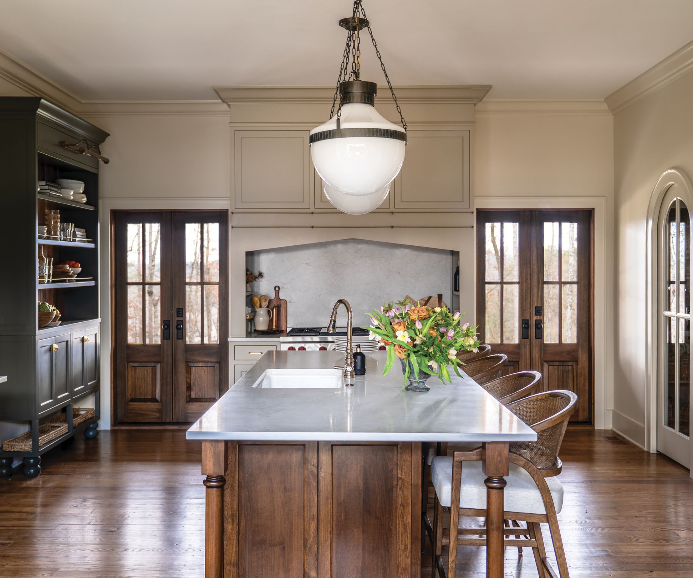 A large kitchen with a wooden island