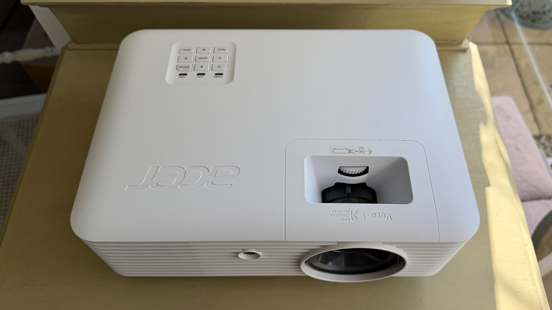 Acer Vero HL6810ATV home cinema projector on wooden furniture top down view