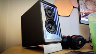 A black Edifier QR65 speaker on a desk