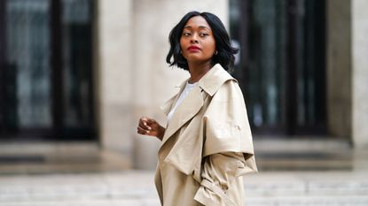 how to wear a trench coat: woman wearing a trench coat