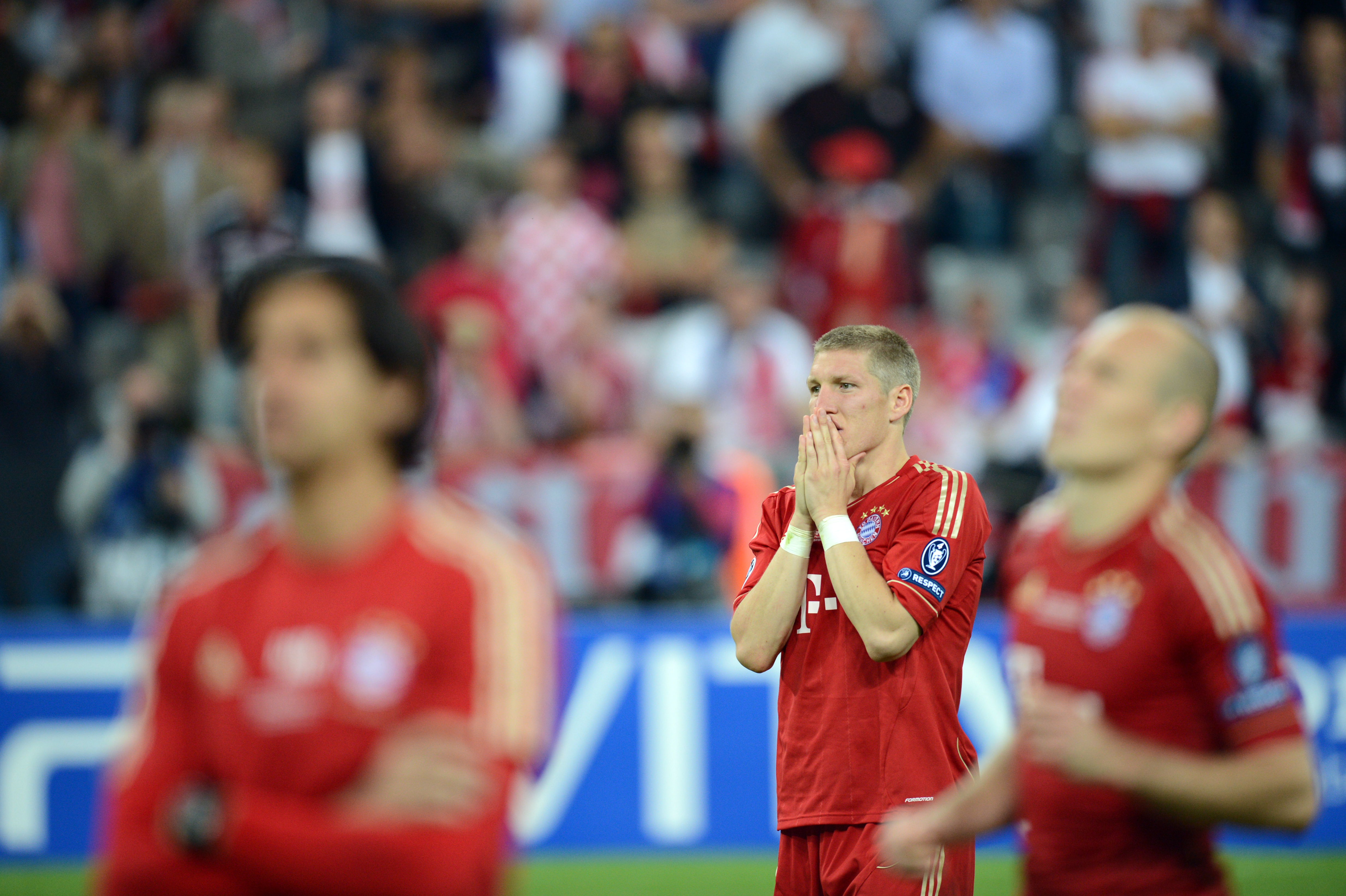 Bastian Schweinsteiger reacts in disappointment after Bayern Munich's defeat against Chelsea on penalties in the 2012 Champions League final at the Allianz Arena.