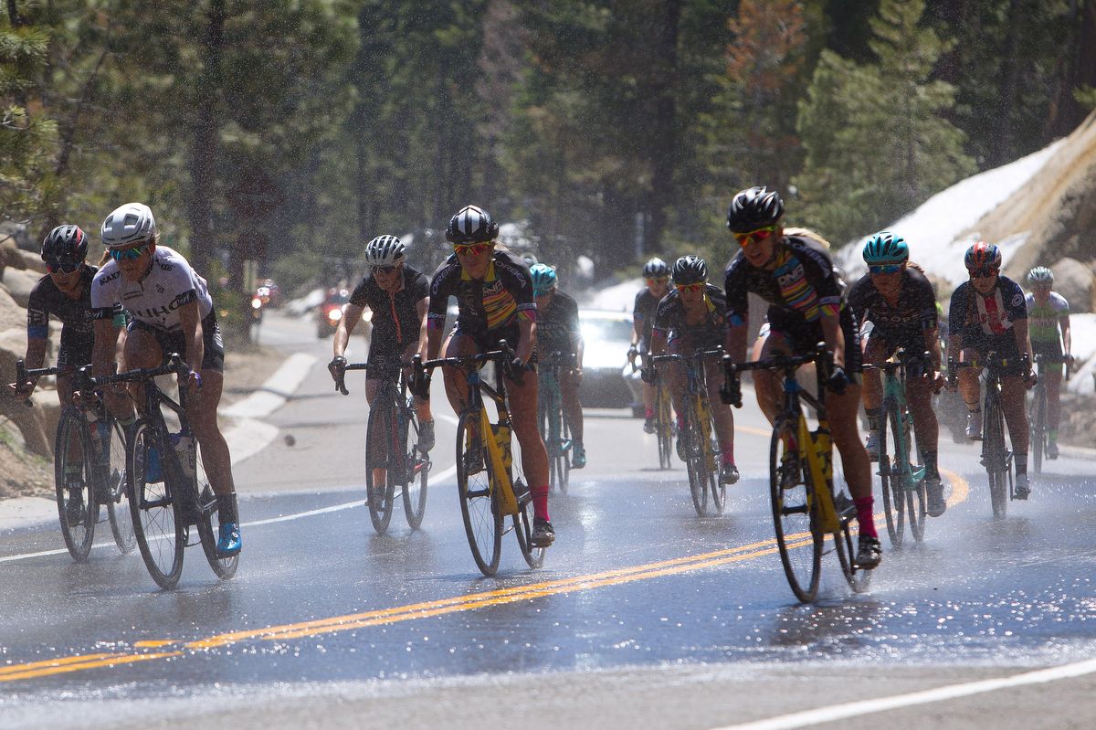 The riders content with a wet sector of road