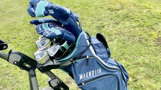 The Wilson Magnolia package set for ladies on a golf trolley