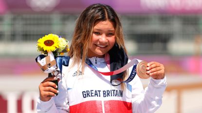 Sky Brown of Team Great Britain poses with her Bronze medal after the Women's Skateboarding Park Finals on day twelve of the Tokyo 2020 Olympic Games at Ariake Urban Sports Park on August 04, 2021 in Tokyo, Japan