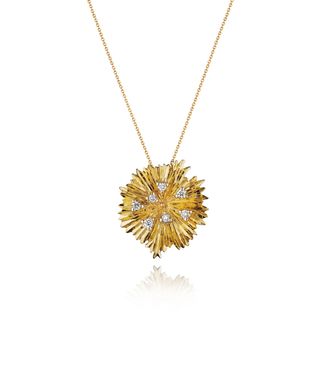 gold necklace with spiky pendant