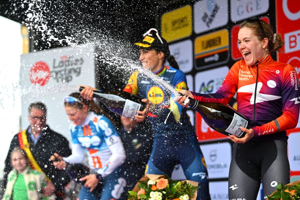 DE PANNE BELGIUM MARCH 21 LR Charlotte Kool of The Netherlands and Team dsmfirmenich PostNL on second place race winner Elisa Balsamo of Italy and Team Lidl Trek and Daria Pikulik of Poland and Team Human Powered Health on third place pose on the podium ceremony after the 7th Womens Classic BruggeDe Panne 2024 a 155km one day race from Brugge to De Panne on March 21 2024 in De Panne Belgium Photo by Luc ClaessenGetty Images