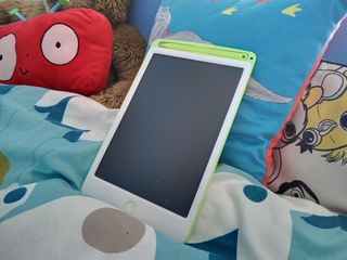 A green and white Richgv LCD Tablet with a green pen