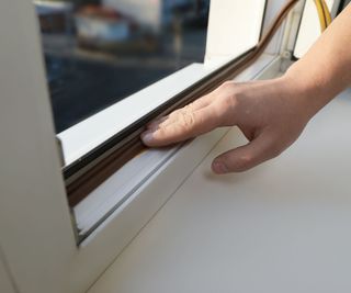 adding weatherstripping to a window