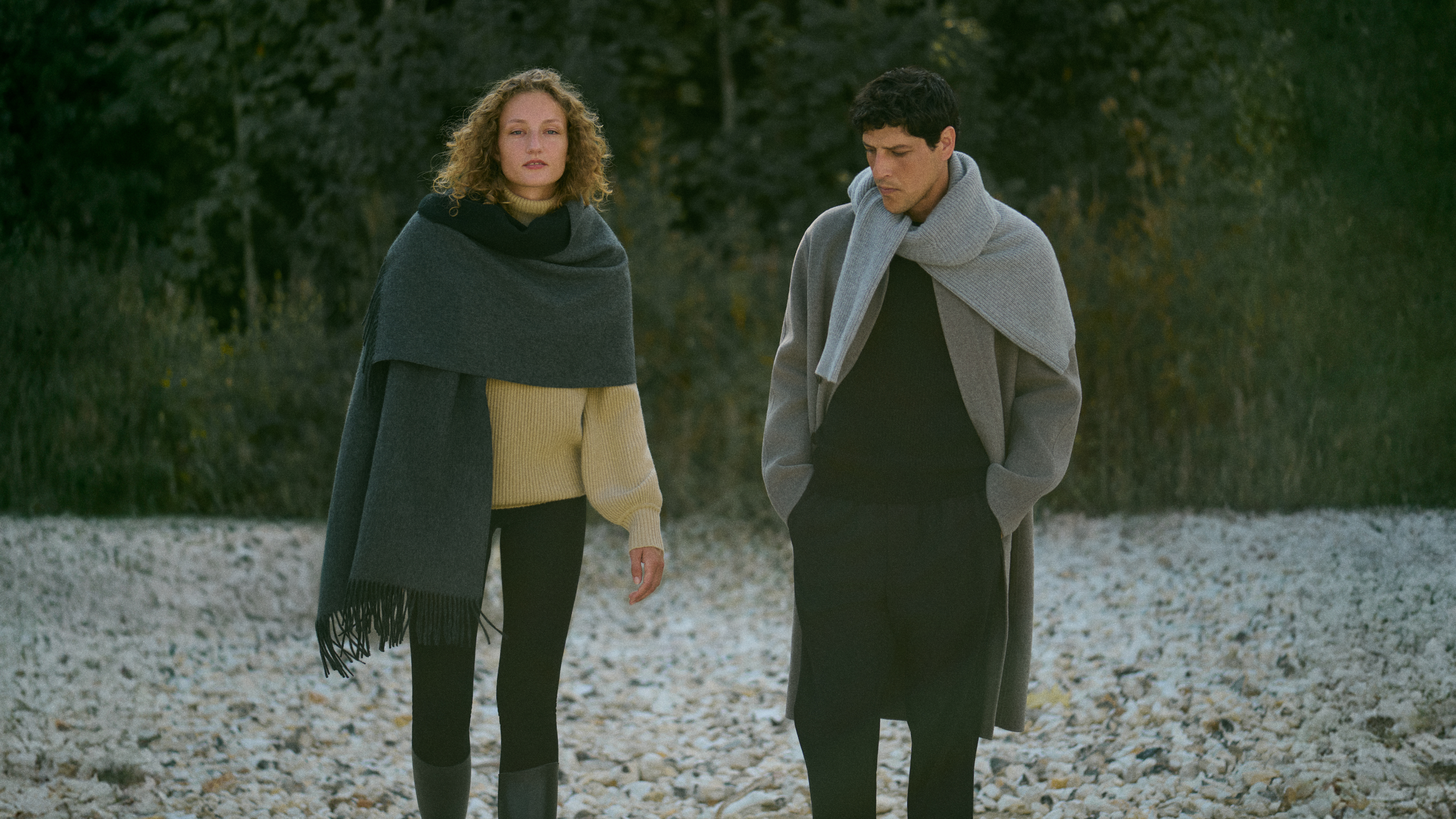 two models posing in knitwear and coats for the rise &amp;amp; fall winter 2025 campaign