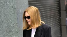 Julianne Moore in sunglasses, black blazer and jeans
