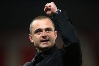 Shaun Maloney, Manager of Wigan Athletic, celebrates victory in front of their fans after defeating Stoke City during the Sky Bet Championship match between Stoke City and Wigan Athletic at Bet365 Stadium on April 18, 2023 in Stoke on Trent, England. (Photo by Gareth Copley/Getty Images)