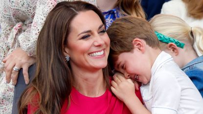 Prince Louis "shielded" by parents. Seen here Princess Catherine and Prince Louis attend the Platinum Pageant 