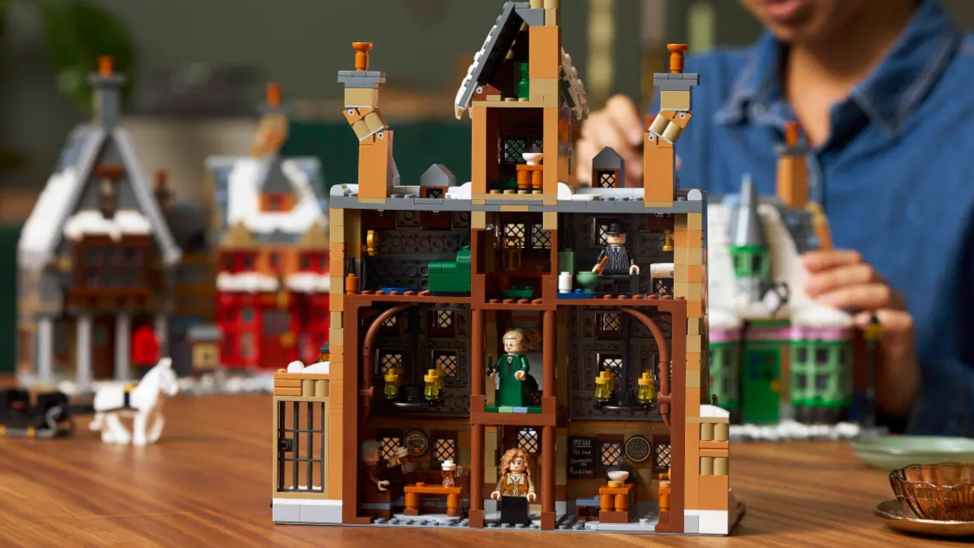 The Lego Hogsmeade Village - Collectors' Edition set seen from behind, showcasing the rooms inside