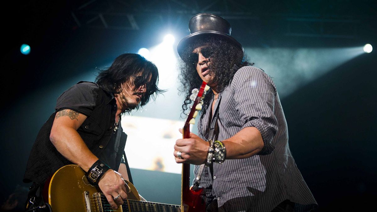 Gilby Clarke and Slash onstage in 2013