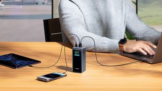 Anker Prime 20,000 mAh on desk charging multiple devices.