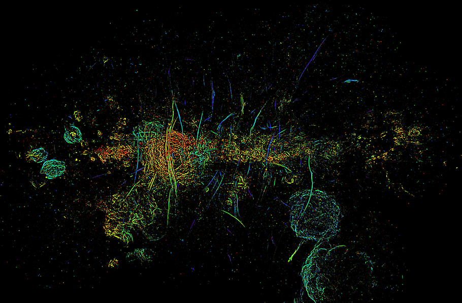 A mosaic image of the enter of the Milky Way in radio waves. The filaments are the vertical slashes throughout the image.