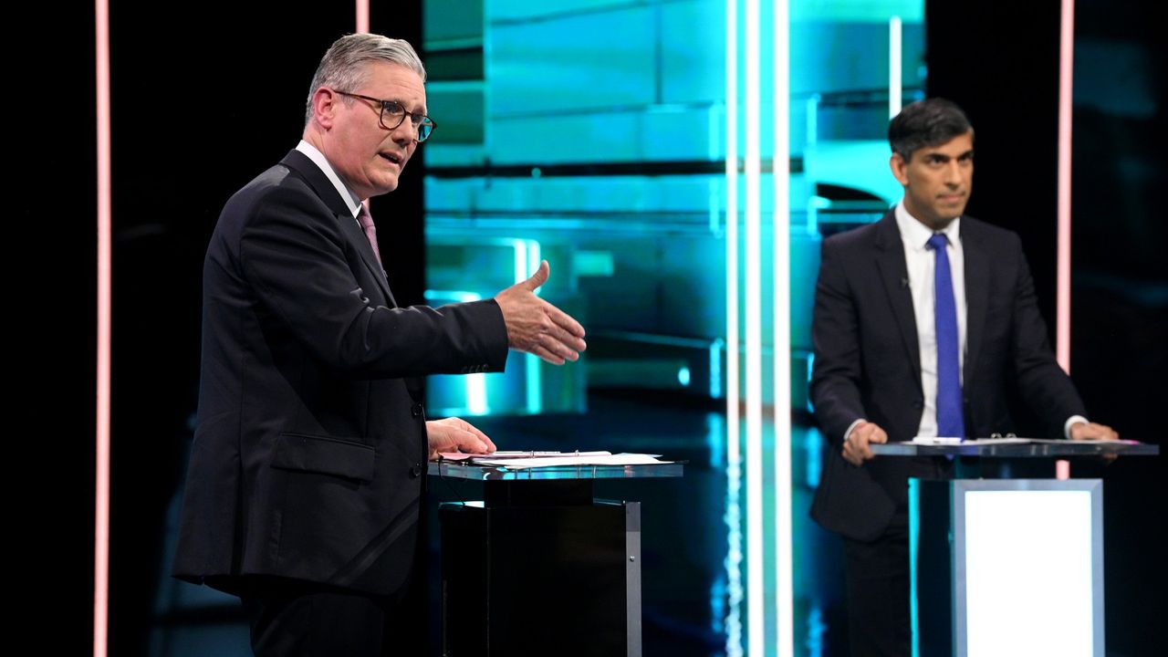 Labour Party leader Keir Starmer (left) and Prime Minister Rishi Sunak speak on stage during the first head-to-head debate of the General Election on 4 June 2024 in Salford, England