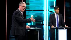 Labour Party leader Keir Starmer (left) and Prime Minister Rishi Sunak speak on stage during the first head-to-head debate of the General Election on 4 June 2024 in Salford, England