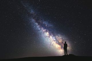Getting yourself in the shot can help add scale and foreground interest to your astro pictures. Image: Thinkstock