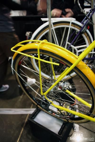 Many builders at NAHBS such as Renald Yip of Yipsan Bicycles were incorporating fender stays into overlying rack structures.