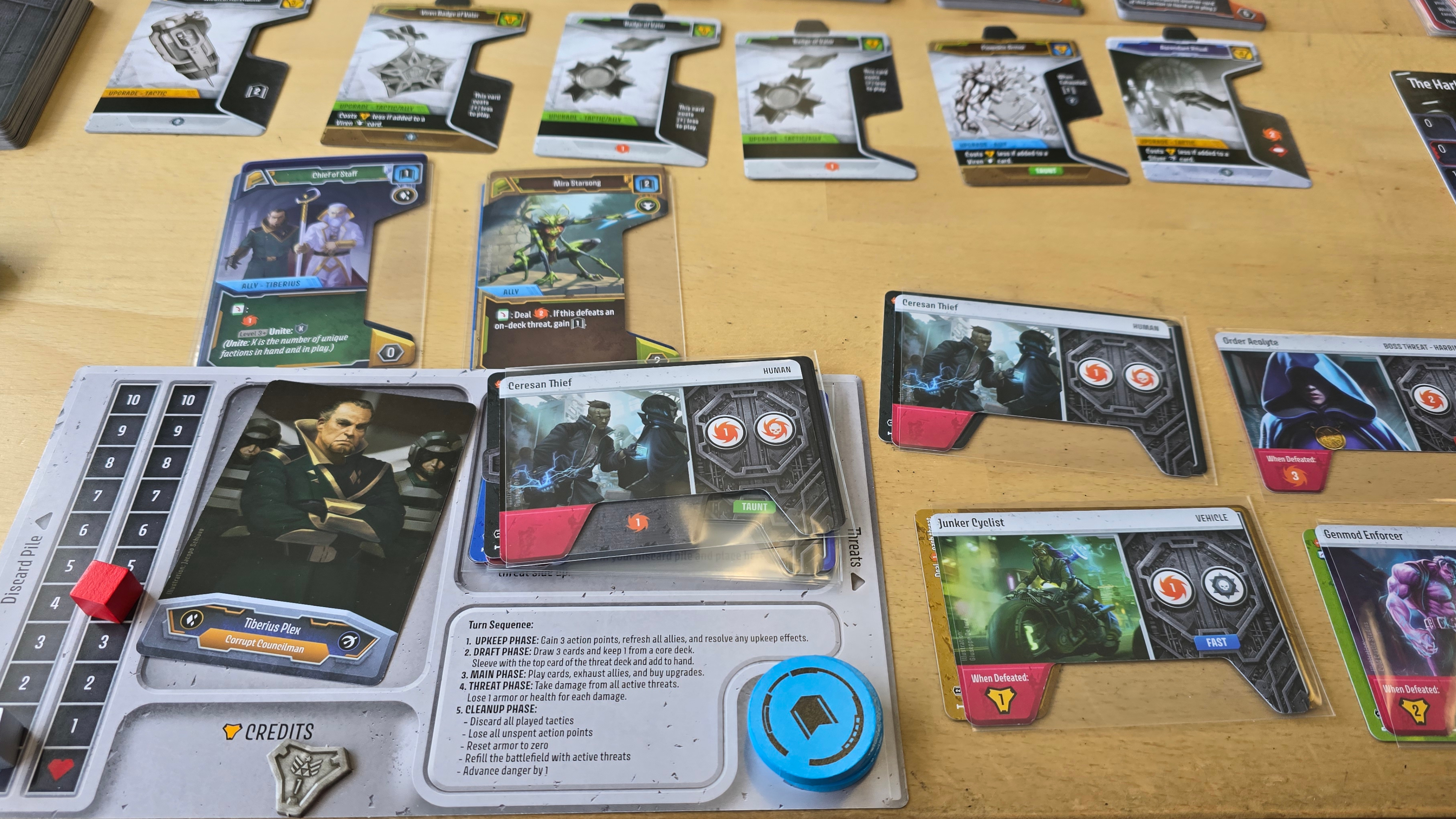 Unstoppable cards and components laid out on a wooden table