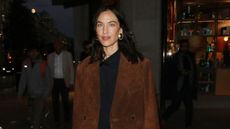 Alexa Chung in a suede jacket and black dress
