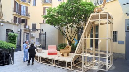 furniture and lighting displayed on timber platform