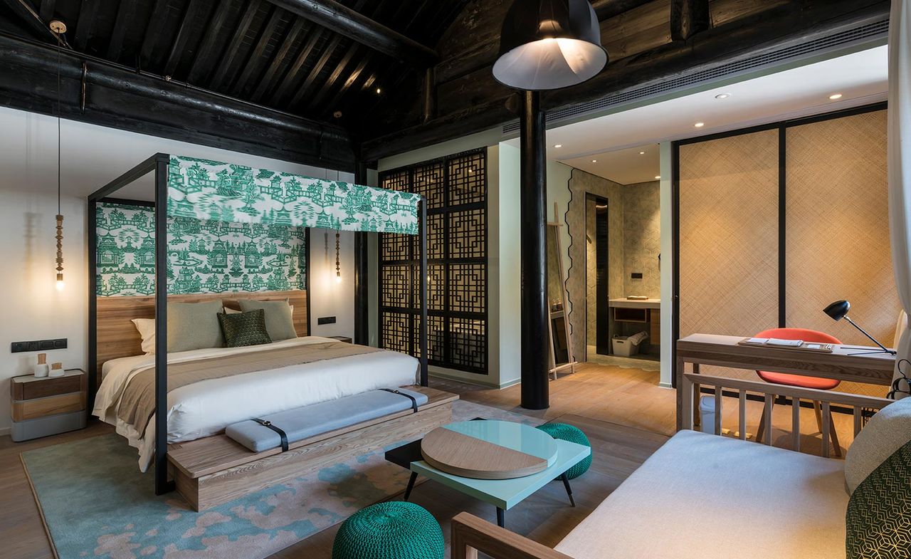 The bedroom of the Blossom Hill Qiu Shu Li hotel in Huzhou, China