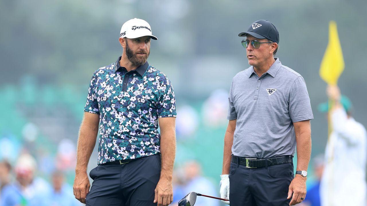 Dustin Johnson and Phil Mickelson during The Masters