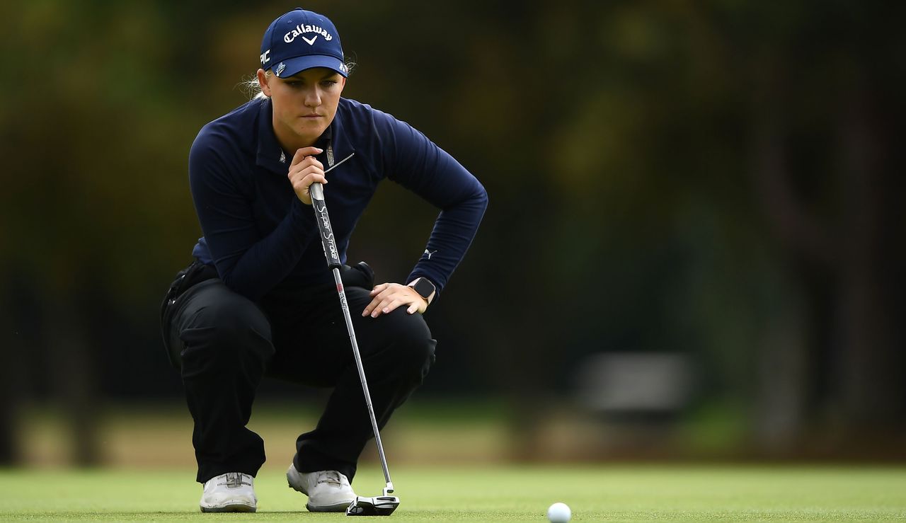 Alana Uriell lines up a putt