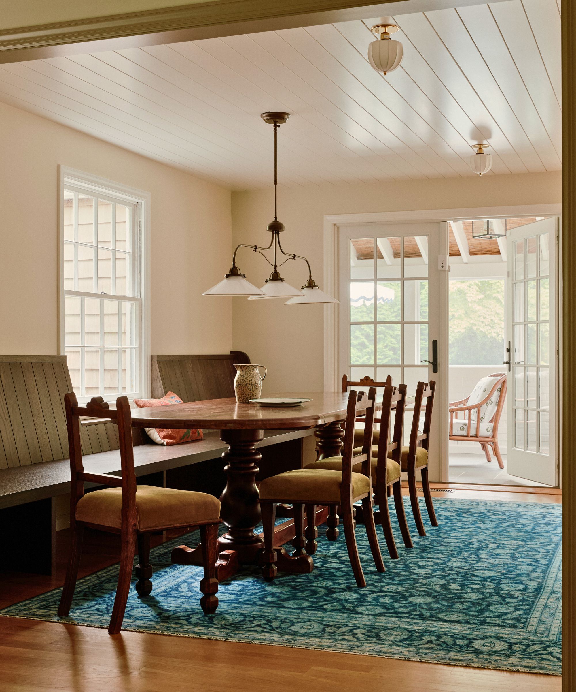 dining room with bench seat and blue rug