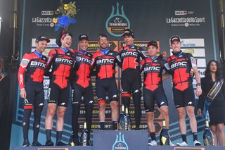 Dennis (right) during happier times, winning the 2018 Tirreno-Adriatico team time trial with BMC
