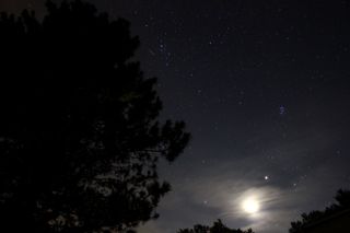 Stargazer Samuel Hartman caught this view of a Perseid meteor and the moon during the shower's peak on Aug. 12, 2012, from State College, Pa.