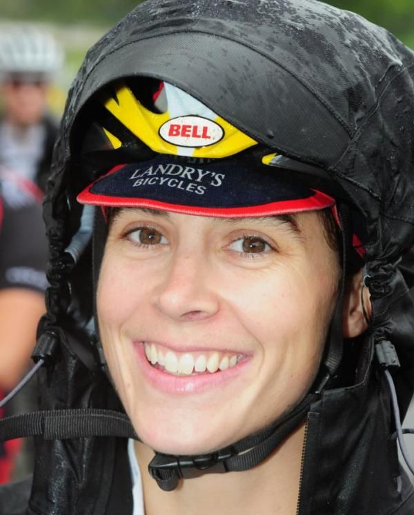 Andrea Smith (Minuteman Road Club) trying to stay dry a bit longer