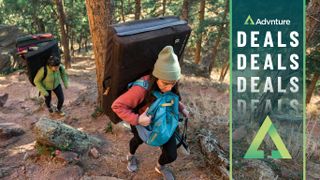 Two people hiking uphill wearing Patagonia clothing